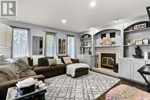 8123 Kestral Drive, Regina, SK - Indoor Photo Showing Living Room With Fireplace