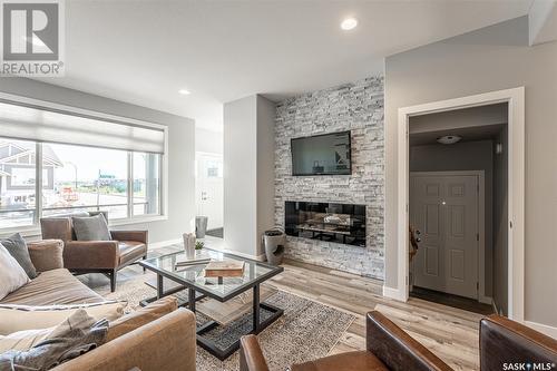 935 Brighton Gate, Saskatoon, SK - Indoor Photo Showing Living Room With Fireplace