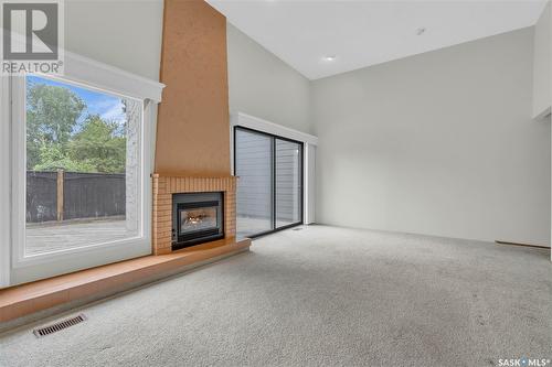 128 Quincy Drive, Regina, SK - Indoor With Fireplace