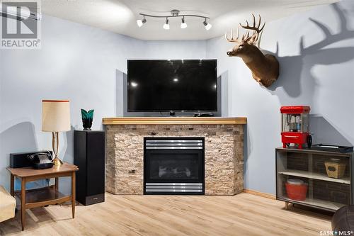 44 Fernwood Street, White City, SK - Indoor Photo Showing Living Room With Fireplace