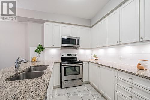 228 - 216 Oak Park Boulevard, Oakville (Uptown Core), ON - Indoor Photo Showing Kitchen With Double Sink With Upgraded Kitchen