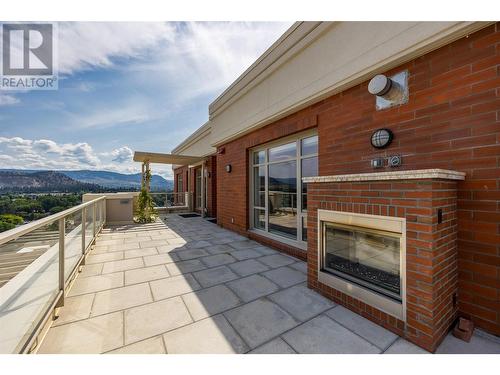 1160 Bernard Avenue Unit# 1701, Kelowna, BC - Outdoor With Fireplace With Exterior