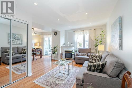 834 - 75 Weldrick Road E, Richmond Hill (Observatory), ON - Indoor Photo Showing Living Room With Fireplace