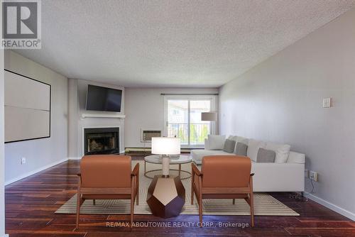 124 - 1496 Pilgrims Way, Oakville, ON - Indoor Photo Showing Living Room With Fireplace