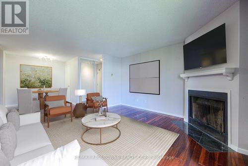 124 - 1496 Pilgrims Way, Oakville (Glen Abbey), ON - Indoor Photo Showing Living Room With Fireplace