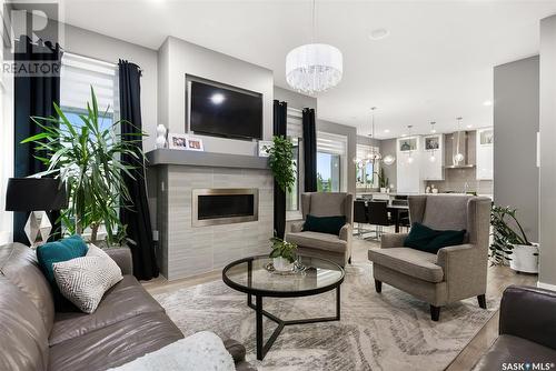 10 Princeton Drive, White City, SK - Indoor Photo Showing Living Room With Fireplace