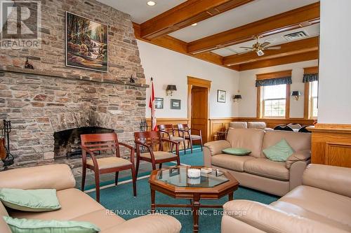 305 - 51 Rivermill Boulevard, Kawartha Lakes (Lindsay), ON - Indoor Photo Showing Living Room With Fireplace