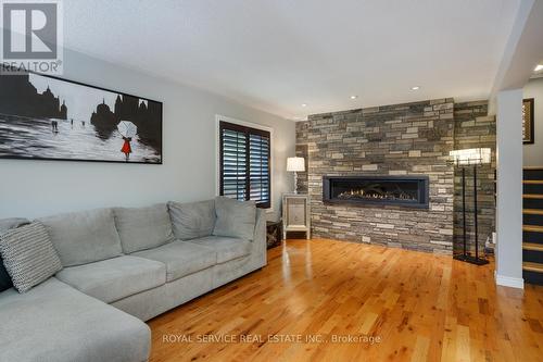 419 Spillsbury Drive, Peterborough (Otonabee), ON - Indoor Photo Showing Living Room With Fireplace