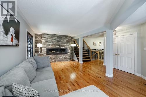 419 Spillsbury Drive, Peterborough (Otonabee), ON - Indoor Photo Showing Living Room With Fireplace