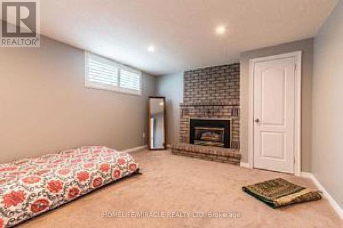 7760 Cavendish Drive, Niagara Falls, ON - Indoor Photo Showing Bedroom With Fireplace