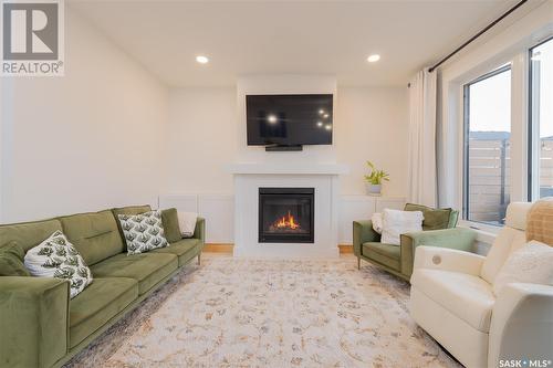 364 Olson Lane E, Saskatoon, SK - Indoor Photo Showing Living Room With Fireplace