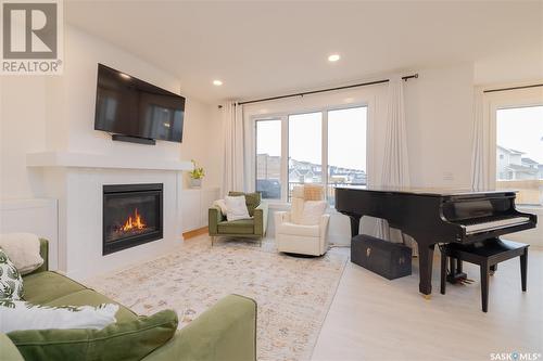 364 Olson Lane E, Saskatoon, SK - Indoor Photo Showing Living Room With Fireplace