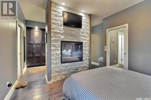 4613 Skinner Crescent, Regina, SK - Indoor Photo Showing Bedroom With Fireplace