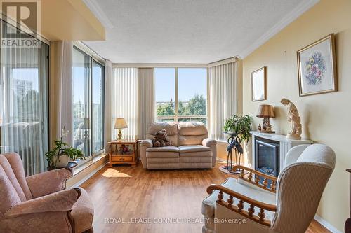 422 - 1880 Valley Farm Road, Pickering, ON - Indoor Photo Showing Living Room With Fireplace