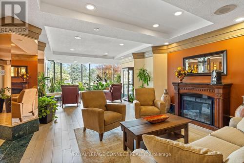 422 - 1880 Valley Farm Road, Pickering, ON - Indoor Photo Showing Living Room With Fireplace