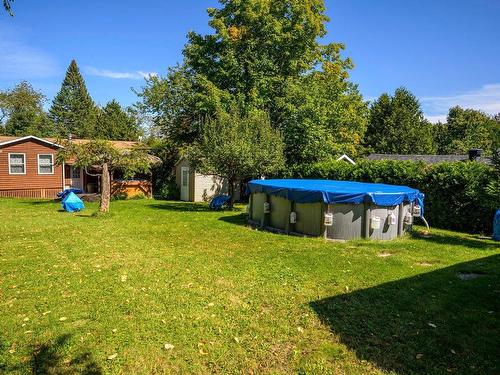 Backyard - 1609 Rue Roy, Prévost, QC - Outdoor With Above Ground Pool With Backyard