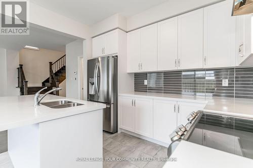 27 Lorne Thomas Place, New Tecumseth, ON - Indoor Photo Showing Kitchen With Stainless Steel Kitchen With Double Sink With Upgraded Kitchen