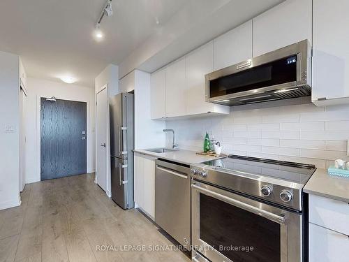 211-1401 O'Connor Dr, Toronto, ON - Indoor Photo Showing Kitchen With Stainless Steel Kitchen With Upgraded Kitchen