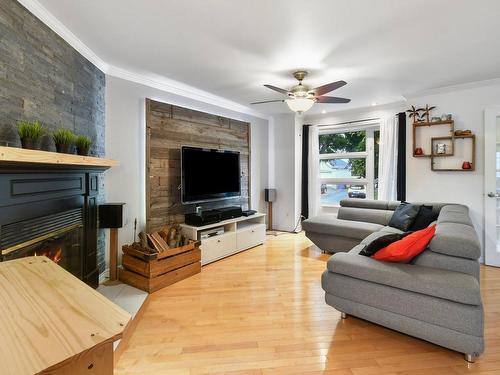 Salon - 881 Rue Einstein, Repentigny (Repentigny), QC - Indoor Photo Showing Living Room With Fireplace