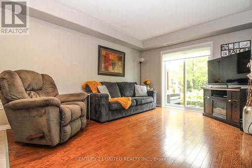 109 - 300 Spillsbury Drive, Peterborough (Otonabee), ON - Indoor Photo Showing Living Room With Fireplace