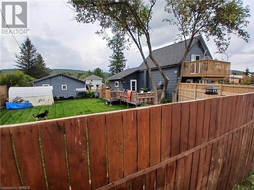 Tall fence installed in 2022 provides plenty of privacy. - 910 John Street, Mattawa, ON - Outdoor With Deck Patio Veranda