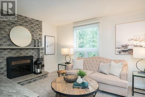 577 Hayward Crescent, Milton, ON - Indoor Photo Showing Living Room With Fireplace