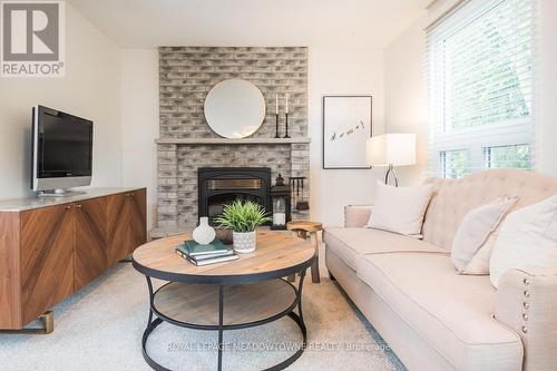 577 Hayward Crescent, Milton, ON - Indoor Photo Showing Living Room With Fireplace