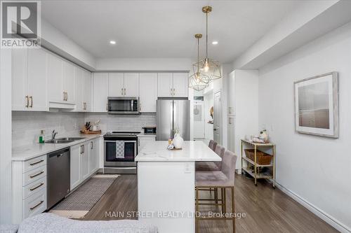 57 Gibson Avenue, Hamilton, ON - Indoor Photo Showing Kitchen With Stainless Steel Kitchen With Double Sink With Upgraded Kitchen