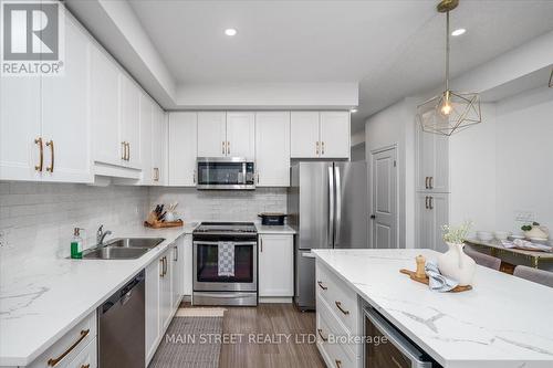 57 Gibson Avenue, Hamilton, ON - Indoor Photo Showing Kitchen With Stainless Steel Kitchen With Double Sink With Upgraded Kitchen