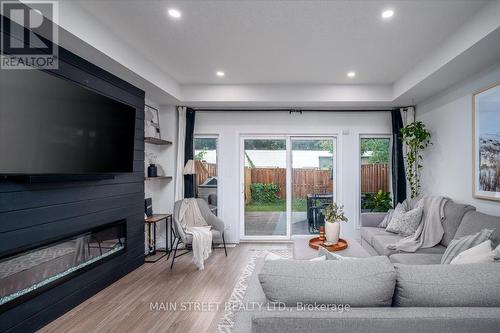 57 Gibson Avenue, Hamilton, ON - Indoor Photo Showing Living Room With Fireplace