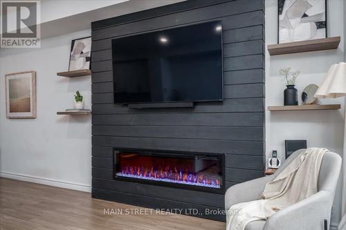 57 Gibson Avenue, Hamilton, ON - Indoor Photo Showing Other Room With Fireplace