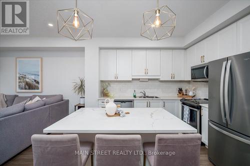 57 Gibson Avenue, Hamilton, ON - Indoor Photo Showing Kitchen With Stainless Steel Kitchen With Double Sink With Upgraded Kitchen