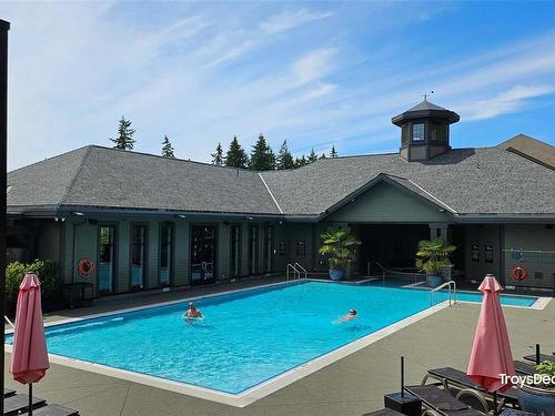 117-1395 Bear Mountain Pkwy, Langford, BC - Outdoor With In Ground Pool With Deck Patio Veranda