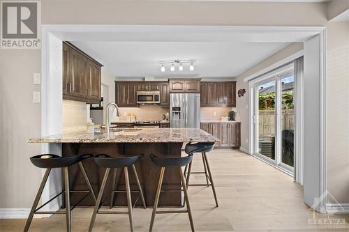 Walk out to no maintenance yard - 713 Mayfly Crescent, Ottawa, ON - Indoor Photo Showing Kitchen With Upgraded Kitchen