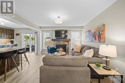 Open Concept with gas fireplace - 713 Mayfly Crescent, Ottawa, ON - Indoor Photo Showing Living Room With Fireplace