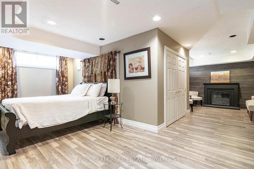 1826 Quantz Crescent, Innisfil, ON - Indoor Photo Showing Bedroom With Fireplace