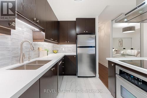 303 - 1 Scott Street, Toronto, ON - Indoor Photo Showing Kitchen With Double Sink With Upgraded Kitchen