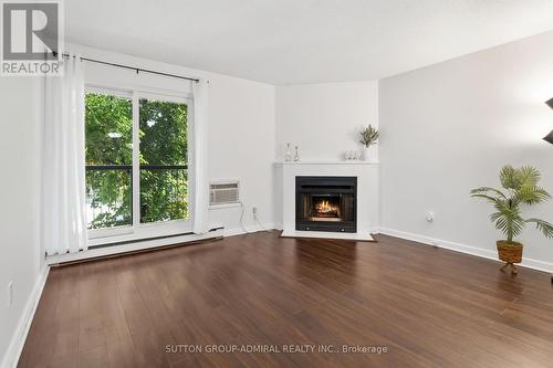 522 - 1450 Glen Abbey Gate, Oakville, ON - Indoor Photo Showing Living Room With Fireplace