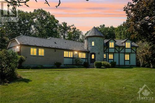 Discover the charm of this captivating French Norman-style residence - 1390 Millburn Crescent, Ottawa, ON - Outdoor