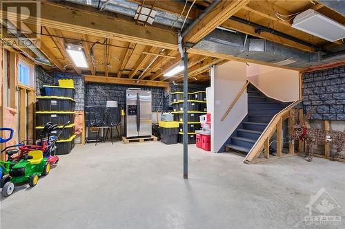 The spacious, unfinished basement offers limitless potential, whether you envision a large recreation room, a workshop, or additional storage. - 1390 Millburn Crescent, Ottawa, ON - Indoor Photo Showing Basement