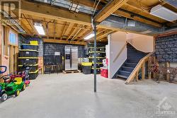 The spacious, unfinished basement offers limitless potential, whether you envision a large recreation room, a workshop, or additional storage. - 