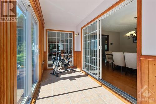 Solarium with patio door access to dining room & living room - 1390 Millburn Crescent, Ottawa, ON - Indoor Photo Showing Other Room