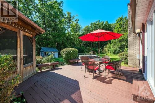 Private backyard oasis with a deck, gazebo, hot tub, sauna, gardens, shed, and play structure. - 1390 Millburn Crescent, Ottawa, ON - Outdoor With Deck Patio Veranda With Exterior