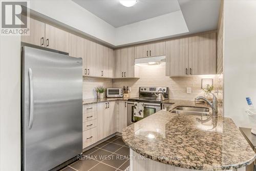 208 - 161 Wellington Street E, New Tecumseth, ON - Indoor Photo Showing Kitchen With Double Sink With Upgraded Kitchen