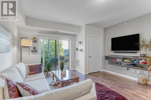 208 - 161 Wellington Street E, New Tecumseth, ON - Indoor Photo Showing Living Room