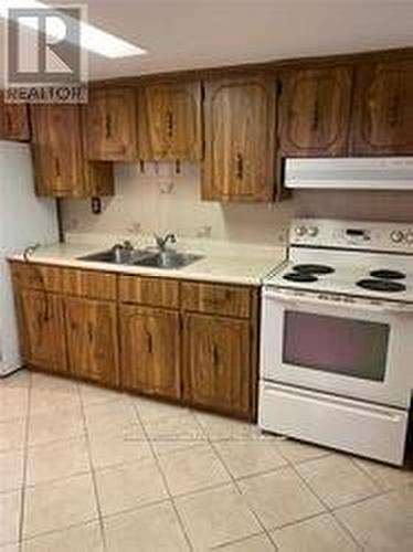 Bsmt - 12 Pendrith Street, Toronto, ON - Indoor Photo Showing Kitchen With Double Sink