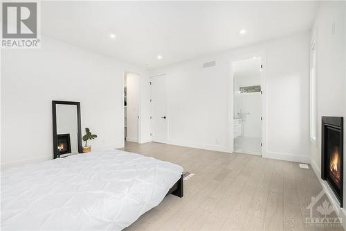 43 Rossland Avenue, Ottawa, ON - Indoor Photo Showing Bedroom With Fireplace