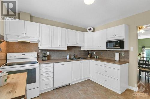 413 Miranda Private, Ottawa, ON - Indoor Photo Showing Kitchen With Double Sink