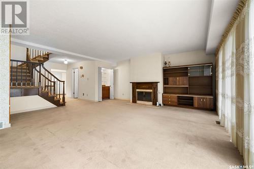 1042 Gryphons Walk, Regina, SK - Indoor Photo Showing Other Room With Fireplace