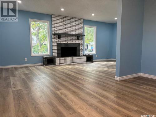 246 Hastings Crescent, Regina, SK - Indoor Photo Showing Living Room With Fireplace